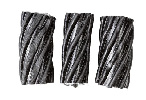 Premium Photo | Coiled black licorice candies isolated on white