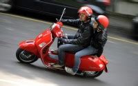 Picture showing the side view of a guy riding the Vespa S 125. Vespa S ...