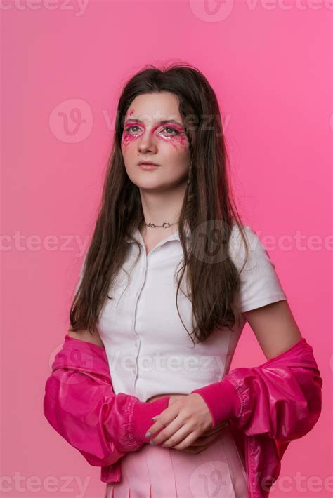 Portrait of 22-year-old female with pink make-up, dressed in pink ...