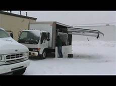 Mobile Garage mobile garage systems paints a car in blizzard using a Mobile Garage mobile garage systems paints a car in blizzard using a