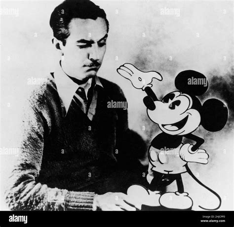 American animator Walt Disney (1901-1966) with the character of Mickey Mouse, whom he created in ...