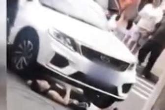 男子蹲车前遭碾压拖行6米远 可怕场面被监控拍下_凤凰网视频_凤凰网