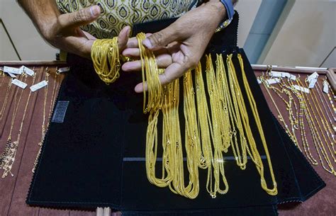 Gold, silver jump in Delhi as rupee slides to record low
