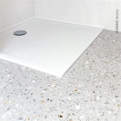 Bathroom floor with light grey terrazzo tiles with white marble chips ...