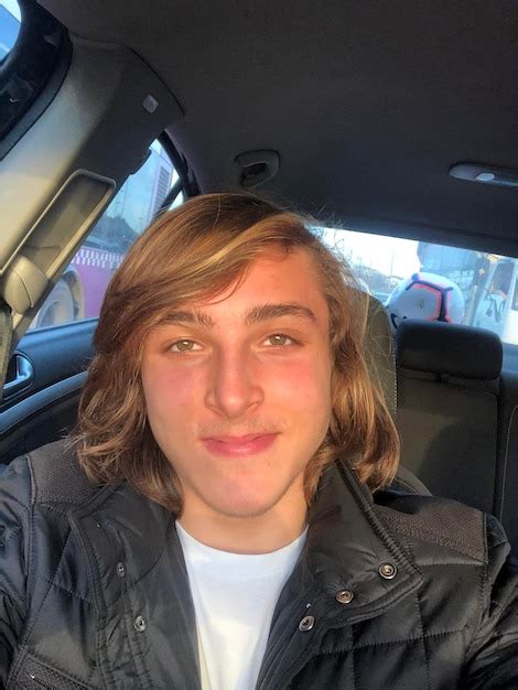 Portrait of smiling man sitting in car | Premium Photo