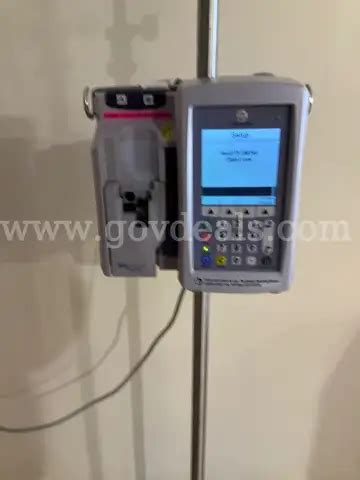 ICU Medical Plum 360 Infusion Pump On 1 Pedigo IV Pole | GovDeals