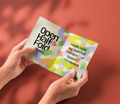 Hand Holding Psd Half Fold Brochure Mockup | Pixeden Club
