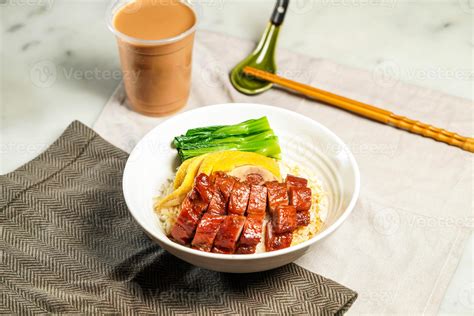 BBQ Pork and Poached Chicken with Rice with milk kopi chopsticks and ...