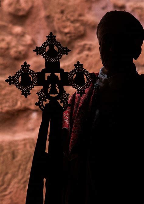 Silhouette of an ethiopian orthodox priest holding a cross, Amhara ...