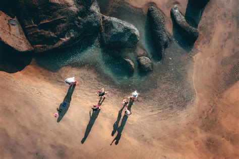 Aerial shots of the turquoise water, reef formations, beach and shipwreck at Henrietta Rocks.