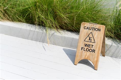 Wooden wet floor caution sign 11732702 Stock Photo at Vecteezy