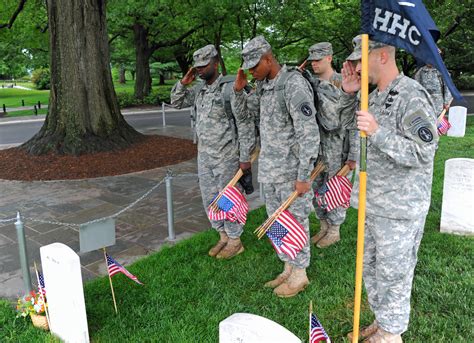 Soldiers participate during Flags In at Arlington Cemetery | Article ...