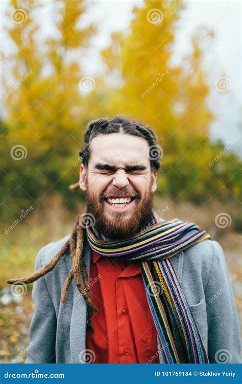 Hipster is Smiling. a Stylish Man with Dreadlocks and Beard in a Red ...