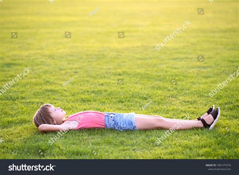 6+ Thousand Little Girls Laying On Grass Royalty-Free Images, Stock ...