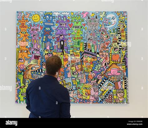 A visitor looks at a painting by artist James Rizzi in Esslingen am ...