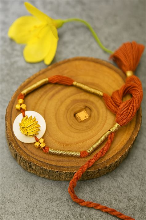Divine Lotus Rakhi – Coral Tree
