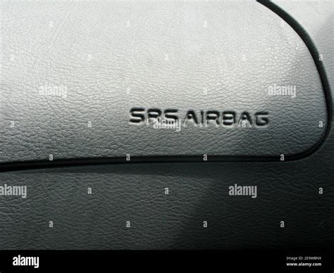 Supplemental Restraint System airbag on black leather interior luxury ...