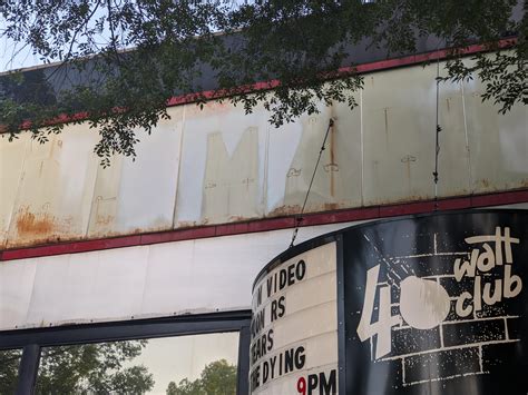 What is the barely legible text above the 40 Watt? : r/Athens