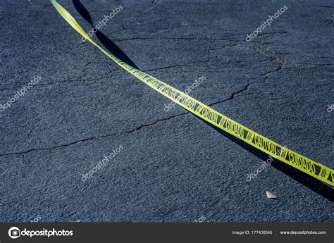 Caution tape in spanish. Yellow tape marked caution in English and ...