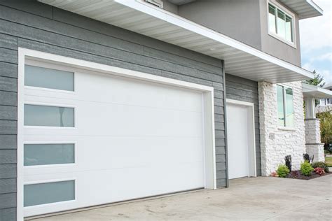 Garage doors with a door in it - Builders Villa