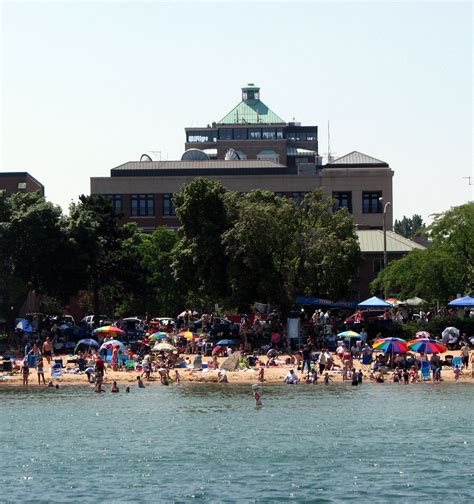 One of the beaches on Grand Traverse Bay, the white sand and clear blue ...
