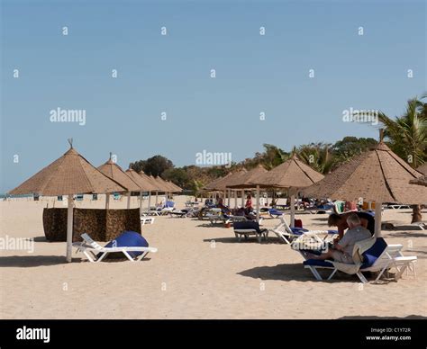 The beach with sunbeds and thatched parasols by the Atlantic Hotel ...