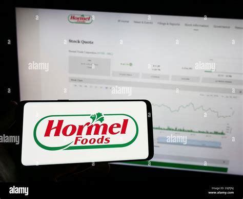 Stuttgart, Germany, 07-02-2023: Person holding mobile phone with logo ...