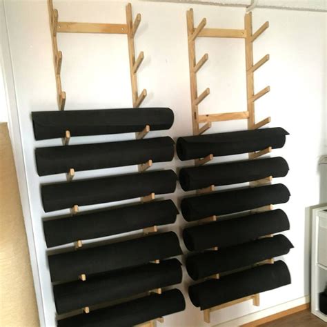 Plywood yoga mat storage at the Kali Collective yoga studio. Made by Altronica | Yoga mat ...