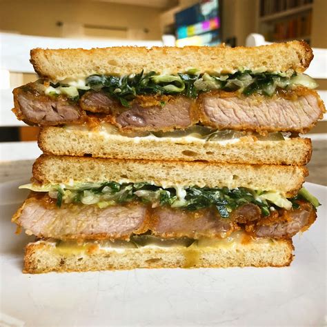 Fried pork chop sandwich, honey butter hot sauce, collard green ...