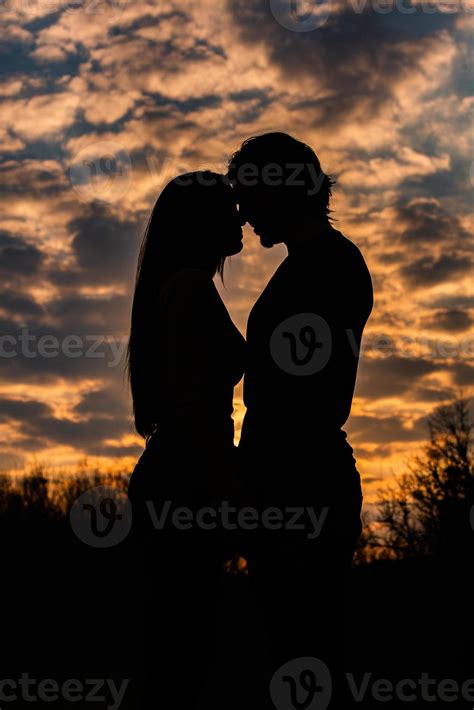 Silhouette of romantic couple in love, man and women in sunset sky. Romantic of relationships ... - silhouette of love