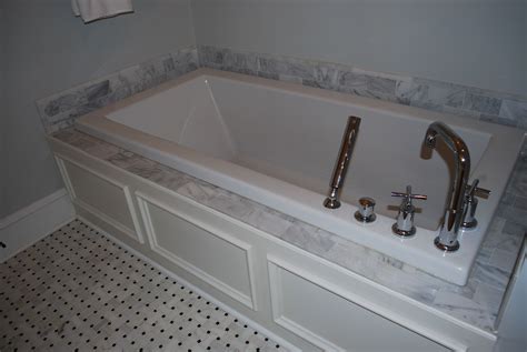 Master Bath - custom designed and built tub panel, white carrara marble ...
