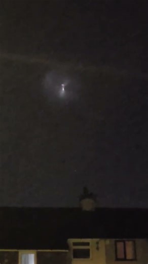 Glowing UFO Hovers in the Night Sky over UK Neighborhood