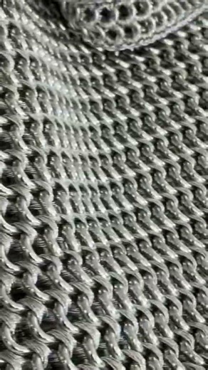 McQueen Autumn Winter 2026 Look 10: metal chainmail and the Locke bag in ostrich stamped leather.