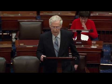 Senator Mitch McConnell honors retiring Senator Mitt Romney in December 2024.