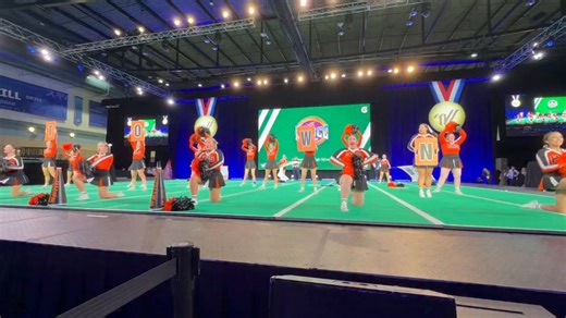 📣🏆 The Hackettstown High School Varsity Cheerleaders are bringing the spirit in Orlando! 🎉✨ 🔥 A look at part of their Game Day performance at the National High School Cheerleading Championship — Large DII 🖤🧡 | Jay Edwards Wrnj