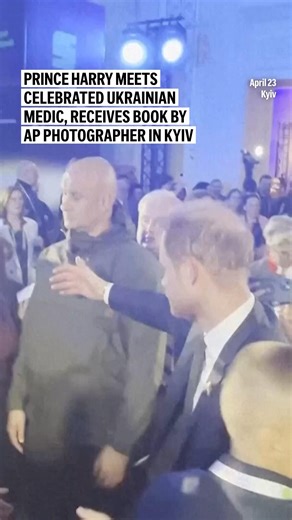Prince Harry meets celebrated Ukrainian medic, receives book by AP photographer in Kyiv