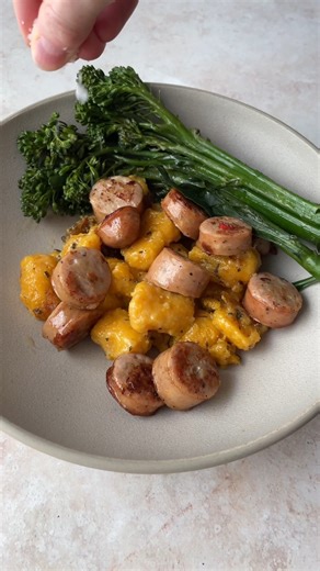 easy Trader Joe’s dinner idea: one pan sweet potato gnocchi with cheddar chicken sausage broccolini! recipe: 1️⃣ heat a skillet over medium high heat and add a little olive oil. cook sliced Trader Joe’s unexpected cheddar chicken sausage until brown on both sides. remove the sausage from the skillet. 2️⃣ reduce the heat to medium, and add Trader Joe’s frozen sweet potato gnocchi with butter and sage. lay broccolini on top, pour in 1/4 cup water, cover the pan with a lid, and steam for 10-12 minu