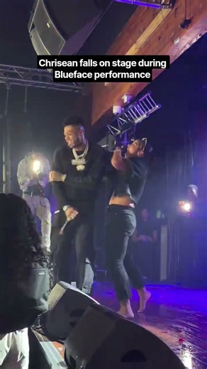 Chrisean Rock falls on stage during Blueface performance