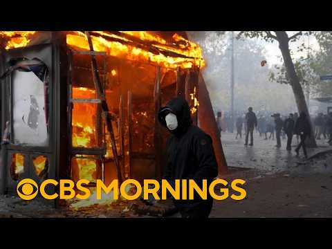 French protests turn violent with looting, torched cars and more