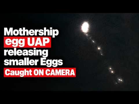 EGG-SHAPED UFO FILMED RELEASING 40+ ORBS?!