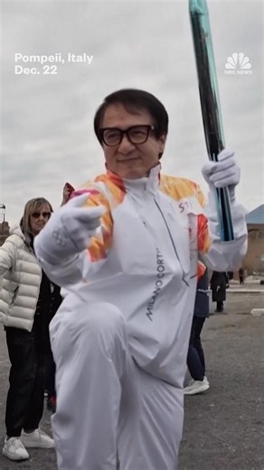 Actor Jackie Chan carried the Olympic torch through the ruins of Pompeii during the relay for the Milan Cortina Winter Games on Monday. | NBC News
