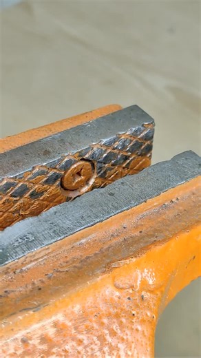 DIY Mechanica on Instagram: "Achieving a perfectly straight tapped thread can be a significant challenge, especially without specialized equipment. I've found a highly effective method that leverages a common coupling nut as a precise guide. The process involves drilling a centered hole through one face of the coupling nut. This modified nut then acts as a template, guiding the tap perpendicular to your workpiece. Simply thread a bolt through the coupling nut to secure it, and proceed with tappi