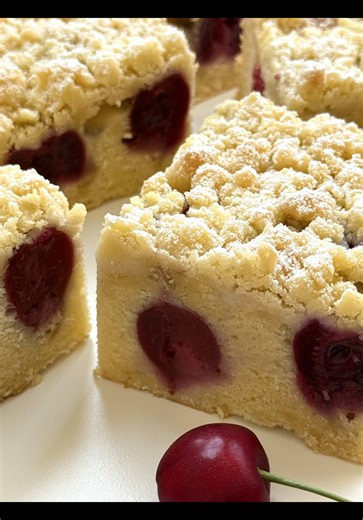 Ad | Cherry Crumble Cake Recipe 🍒🤍 Moist vanilla butter cake topped with juicy cherries and buttery crumble – a timeless classic that’s perfect for any coffee break. 🥰 📝 Ingredients Baking pan: 23 × 23 cm Crumble • 70 g cold butter (5 tbsp) • 60 g sugar (¼ cup 1 tbsp) • 140 g all-purpose flour (1⅛ cups) Cake Batter • 180 g butter, softened (¾ cup 1 tbsp) • 150 g sugar (¾ cup) • some freshly ground vanilla • 4 eggs (medium size) • 70 g creamy plain yogurt (¼ cup) • 230 g all-purpose flour (1¾