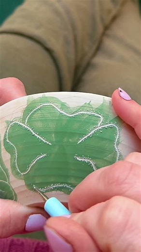 Hand painting and sgraffito-ing some doodle flowers on this handmade pottery trinket bowl.