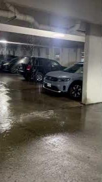 Pouring rain in a downtown parking garage