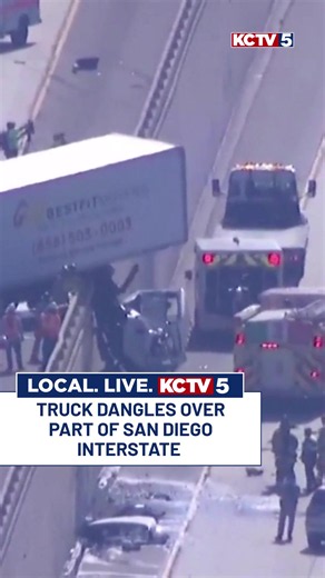 San Diego crash: truck dangling over highway — occupants uninjured
