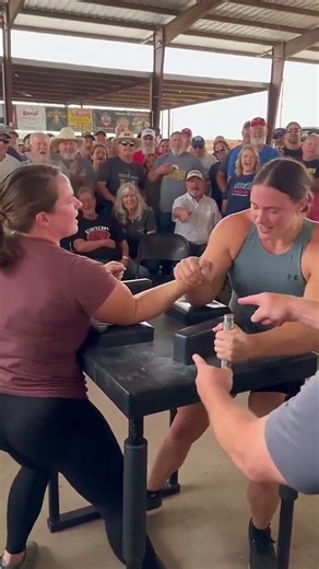 Intense Female Arm Wrestling: Muscular Athlete Powers Through for the Win