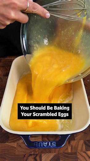 These Baked Scrambled Eggs are light, fluffy, and are a snap to put together for a big crowd! 🥚✨ Get the full recipe details below or at the link in our bio. ⤴️ Ingredients: 1/2 cup butter, melted 24 large eggs 2 1/2 teaspoons salt 2 1/2 cups milk Directions: Gather all ingredients. Preheat the oven to 350 degrees F (175 degrees C). Pour melted butter into a 9x13-inch glass baking dish. Whisk eggs and salt together in a large bowl until well blended. Gradually whisk in milk. Pour egg mixture in