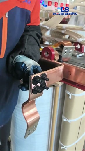 🔩 Watch Busbars Get Secured on a Transformer Body!