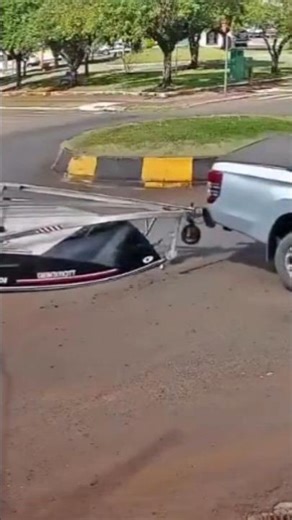 Boat Trailer Flips in Roundabout! Huge Towing Fail caught on Camera